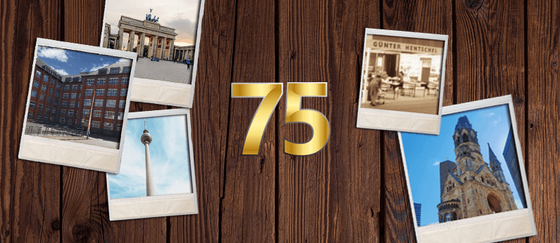Vor einem Hintergrund aus dunklen Brettern liegen fünf Polariods von Berliner Sehenswürdigkeiten und dem Gebäude in dem der Hentschel Vertrieb ansässig ist. In der Mitte ist eine goldene 75.