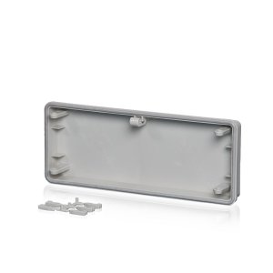Polycarbonat-Anbauflansch, ohne Vorprägung und mit Befestigungskeilen sowie einer Dichtung, hinter einem transparenten Hintergund.
